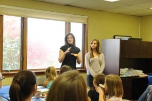 Meredith and Sofie Jacobs talk to the crowd at the Boulder JCC.
